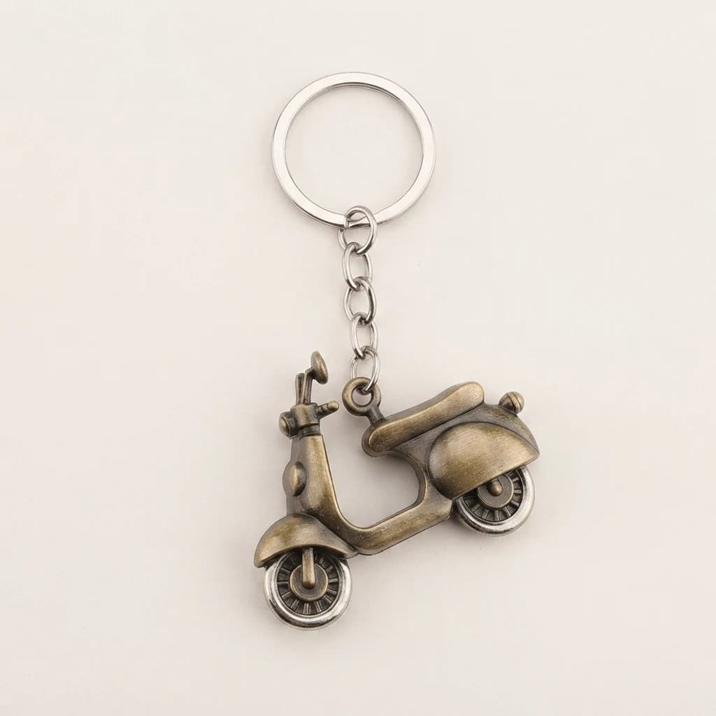 Scooter keyring with an antique gold finish showing the charm, chain, and top ring on a white backdrop.
